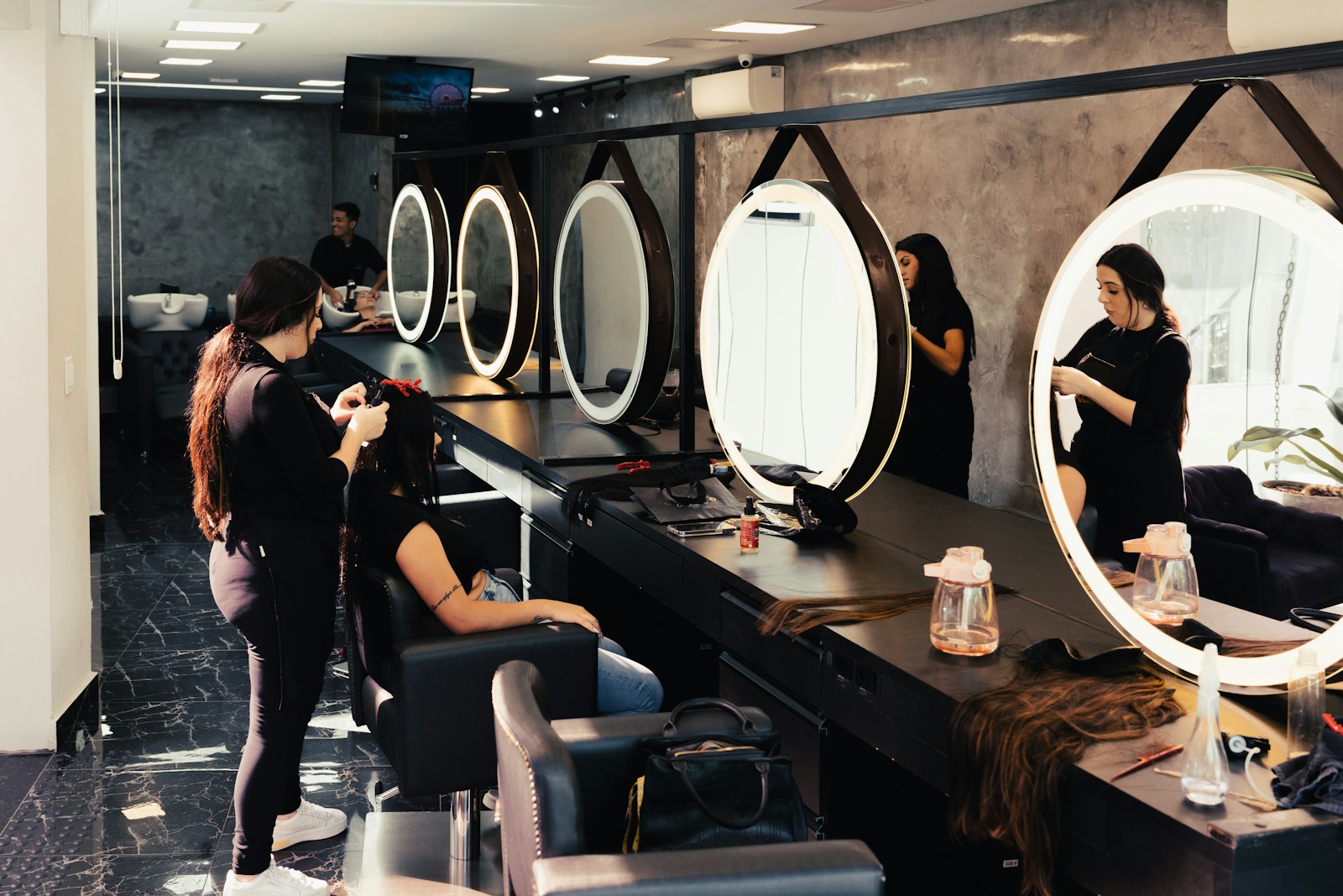 a woman getting her hair done in a salon